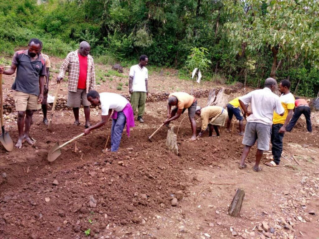 One group works on a moat under supervision.  